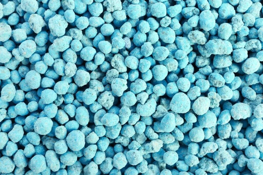 Blue granular fertiliser in close-up